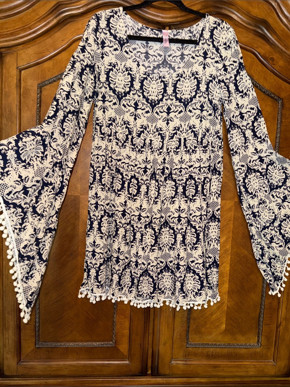 Navy and Cream Bell Sleeve Boho Blouse with Pom Trim